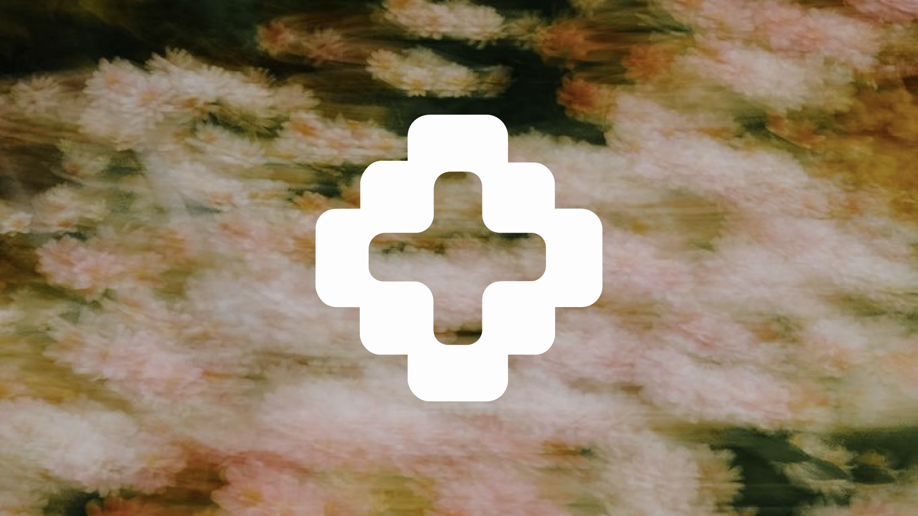 Accord’s white geometric symbol on a softly blurred floral background.
