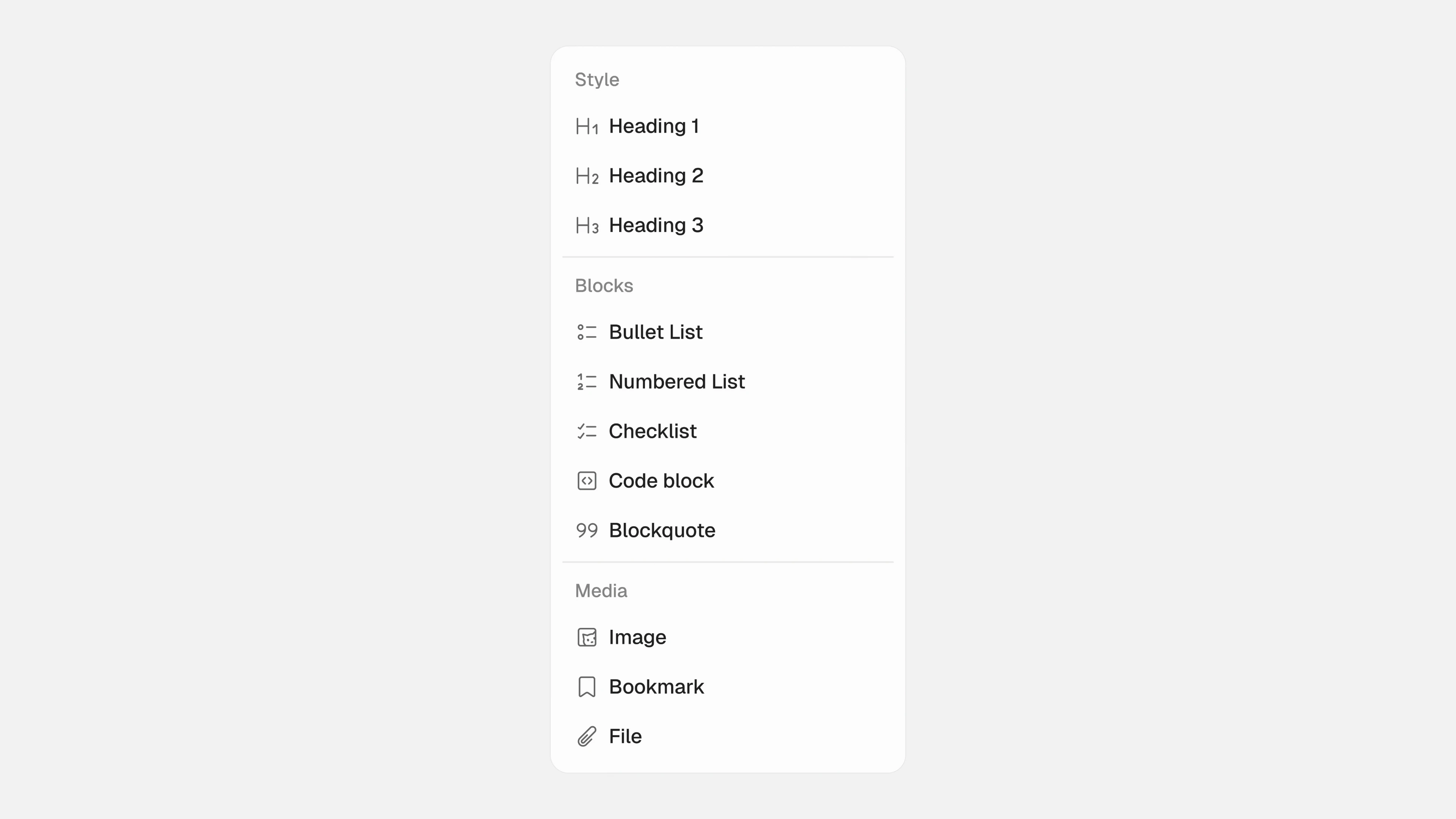 Light formatting menu divided into Style, Blocks, and Media, with headings, lists, code, quotations, and attachment options.